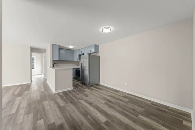a view of kitchen with wooden floor