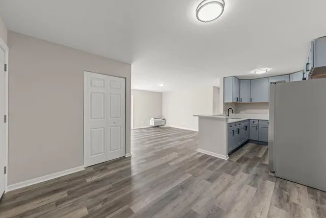 a view of kitchen with wooden floor