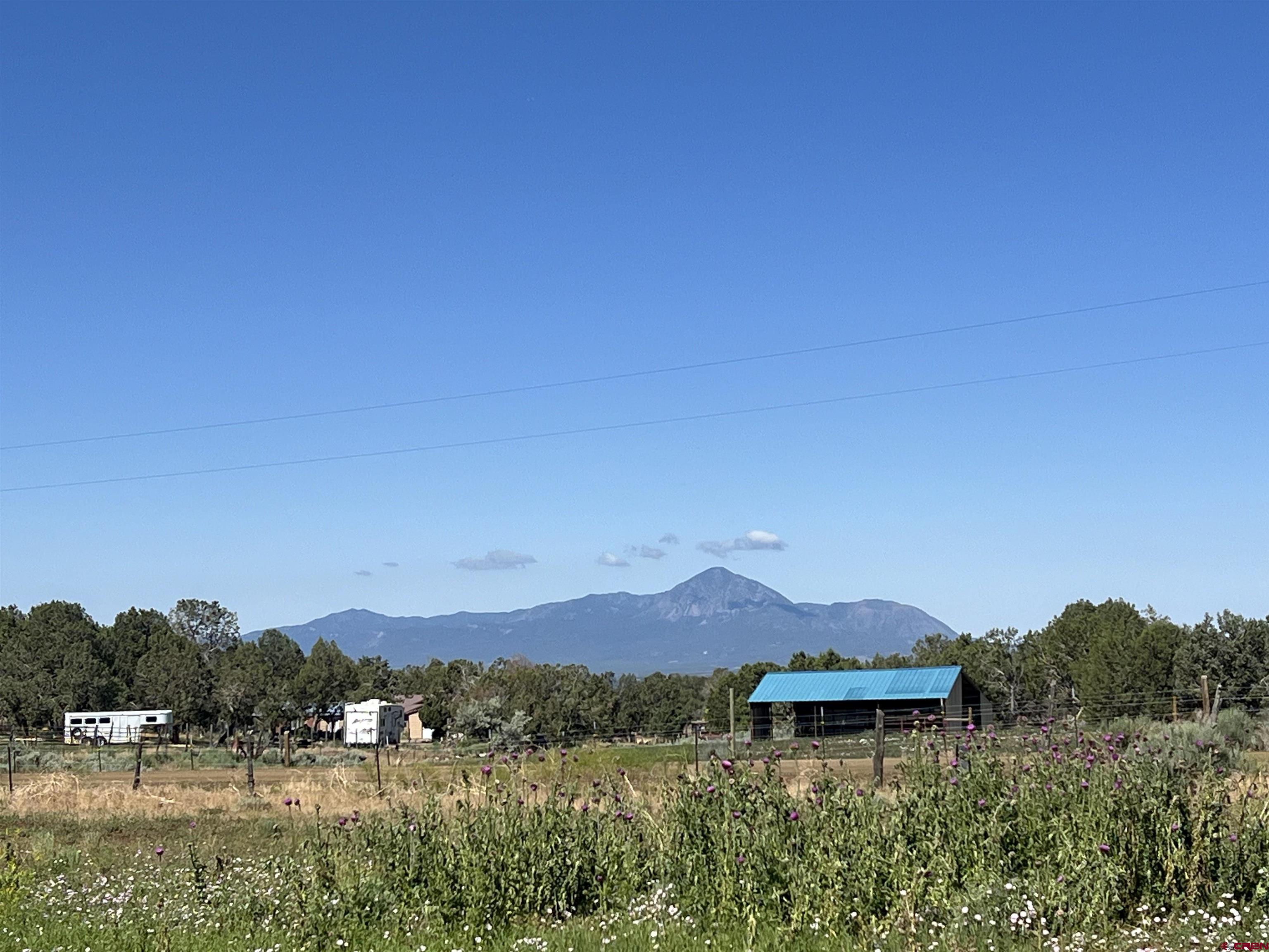 Lot 7 Road N 2 Mancos Co 81328 Mancos, CO 81328 - Photo 12 of 17 a view of a lake with mountains in the background