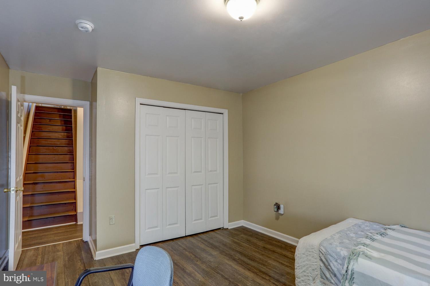 417 Green Street Lancaster, PA 17602 - Photo 33 of 37 a bedroom with a bed and wooden floor
