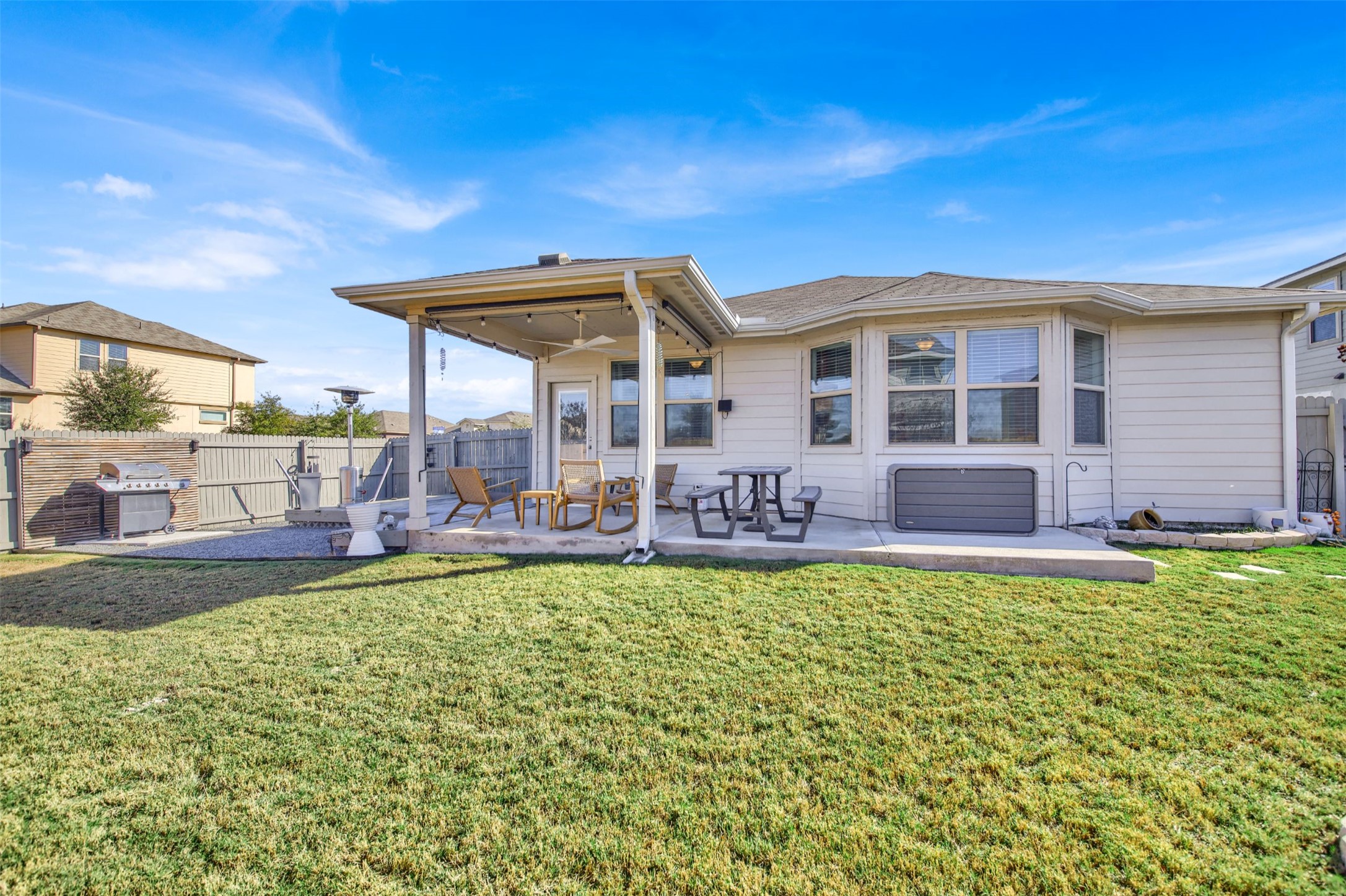 19032 Quebrada Drive Pflugerville, TX 78660 - Photo 28 of 29 Rear view of house featuring a patio and a fenced backyard