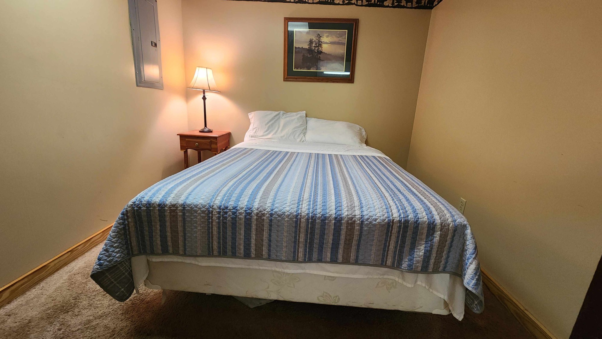 228 Bill Hunter Road Celina, TN 38551 - Photo 22 of 51 a bedroom with a bed and lamp on desk