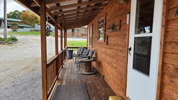 a view of a porch with wooden floor