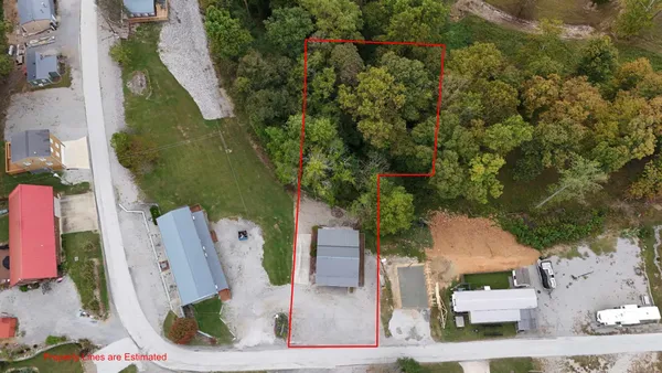 an aerial view of houses with outdoor space