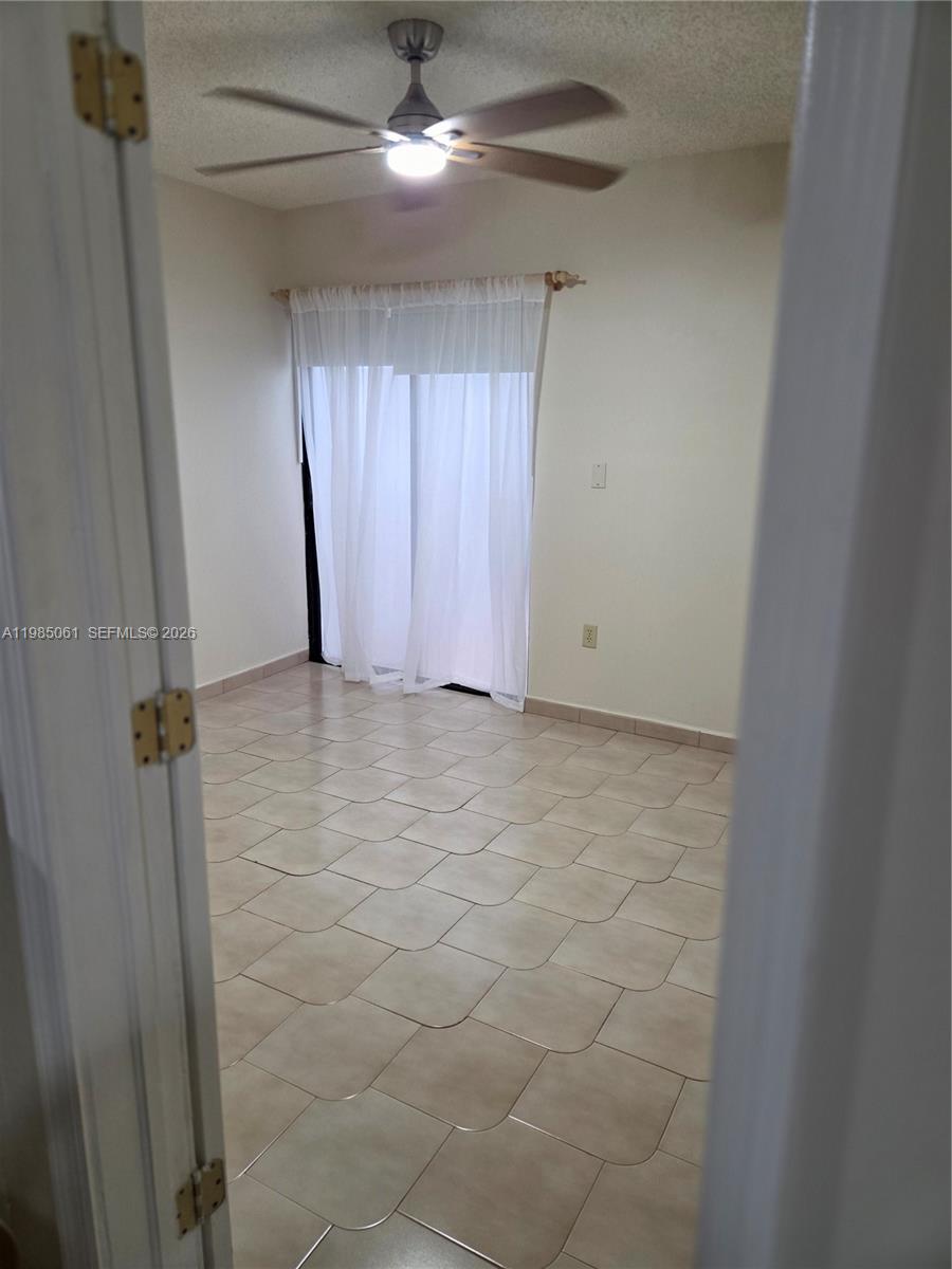 2931 Southwest 135th Avenue Miami, FL 33175 - Photo 15 of 20 a view of an empty room with a window