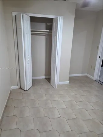 a bathroom with a glass shower door and a sink