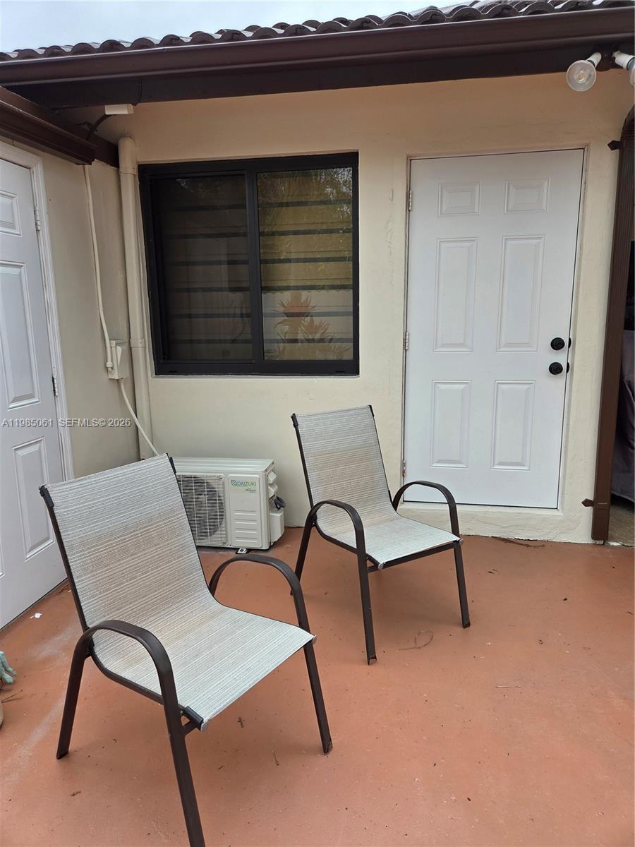 2931 Southwest 135th Avenue Miami, FL 33175 - Photo 2 of 20 a view of a room that has a bench and chair