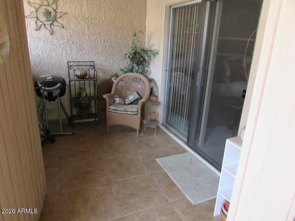 99 North Cooper Road, Unit 138 Chandler, AZ 85225 - Photo 6 of 13 Tiled enclosed patio