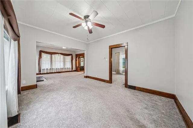 a kitchen with stainless steel appliances granite countertop a sink a counter space and wooden floor