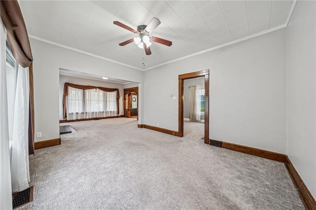 15 Hickory Street Burgettstown, PA 15021 - Photo 12 of 36 an empty room with chandelier fan and windows