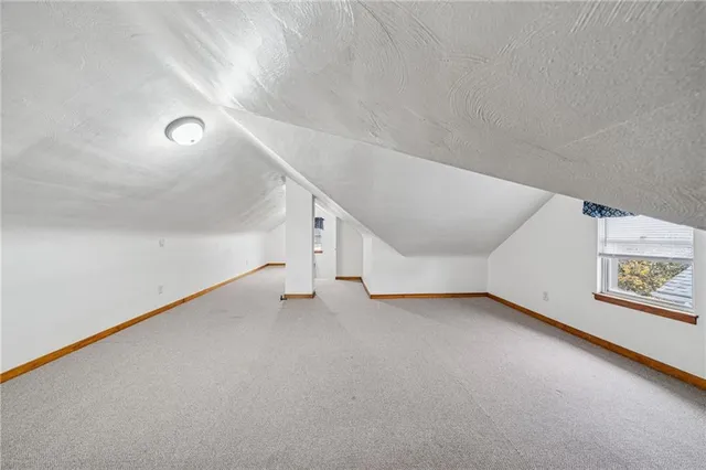 a view of a big room with closet and windows