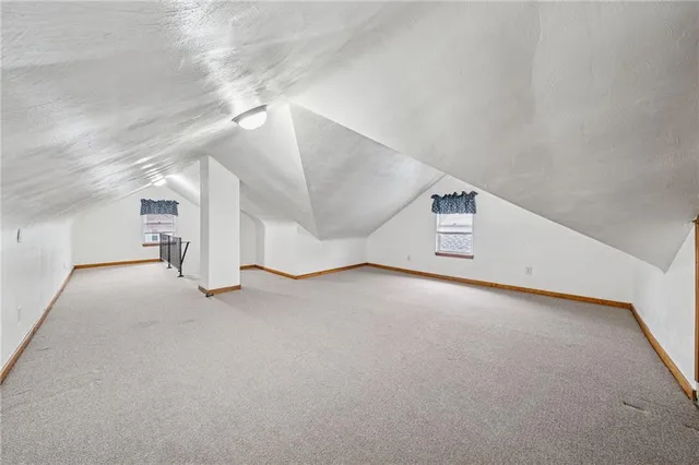 a view of a room with stairs and a ceiling fan