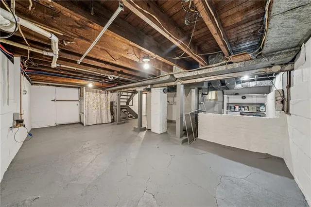 a view of a roof deck with table and chairs and wooden floor