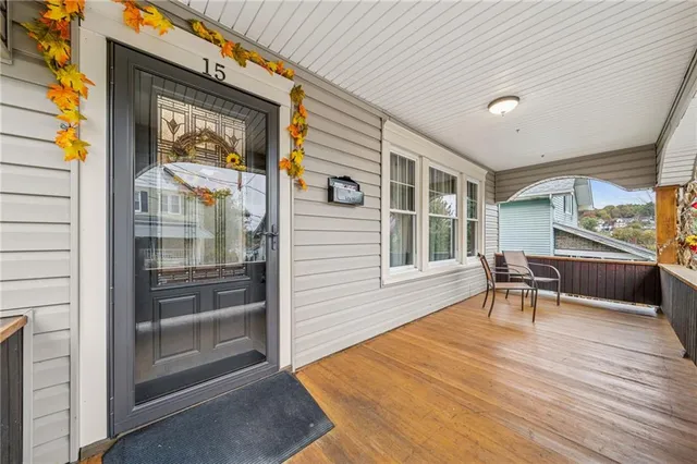 a dining room with wooden floor and a window