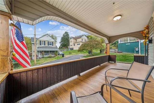 a view of a chairs and table in the balcony