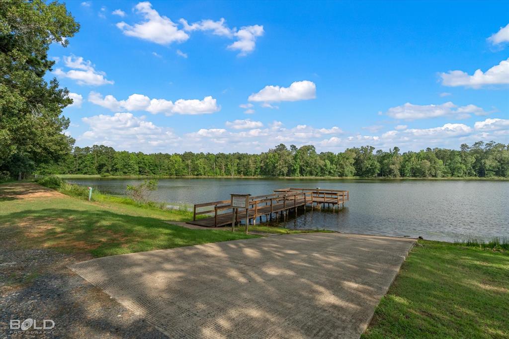 0 Twin Lakes Road Mansfield, LA 71052 - Photo 15 of 28 Waterfront property featuring a private boat ramp, wooden dock, and expansive water frontage