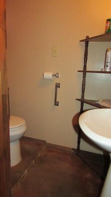 2025 Eastbrook Road New Castle, PA 16101 - Photo 12 of 20 a bathroom with a sink a toilet and mirror