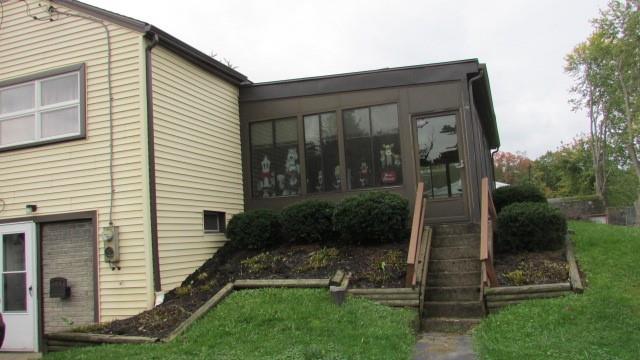 2025 Eastbrook Road New Castle, PA 16101 - Photo 19 of 20 a view of a house with brick walls and a yard with plants