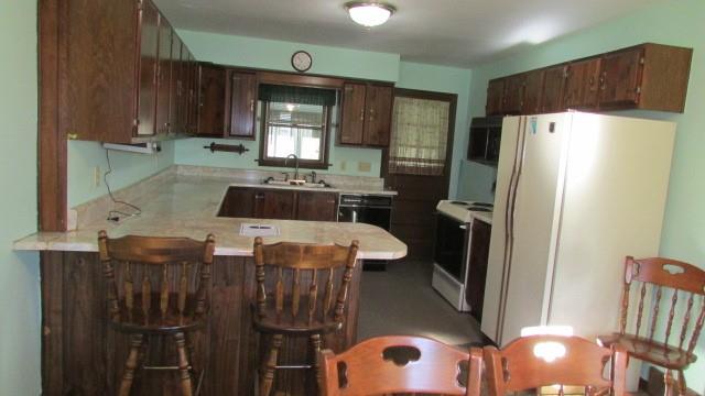 2025 Eastbrook Road New Castle, PA 16101 - Photo 3 of 20 a kitchen with refrigerator and cabinets