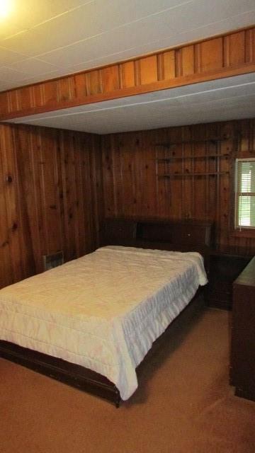 2025 Eastbrook Road New Castle, PA 16101 - Photo 8 of 20 a bed sitting in a bedroom next to a cabinet