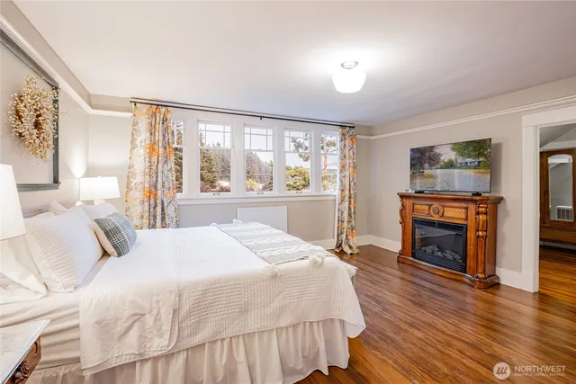 a bedroom with two beds and a chandelier