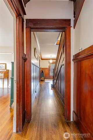 a view of an entryway with wooden floor