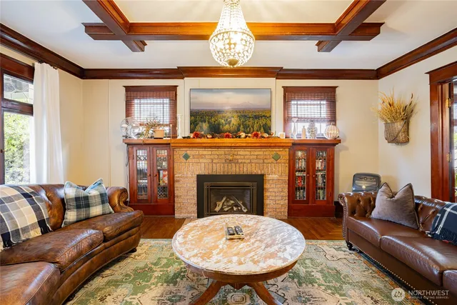 a view of a house with a backyard and chairs