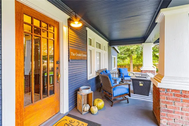 a kitchen with stainless steel appliances granite countertop a sink window and cabinets