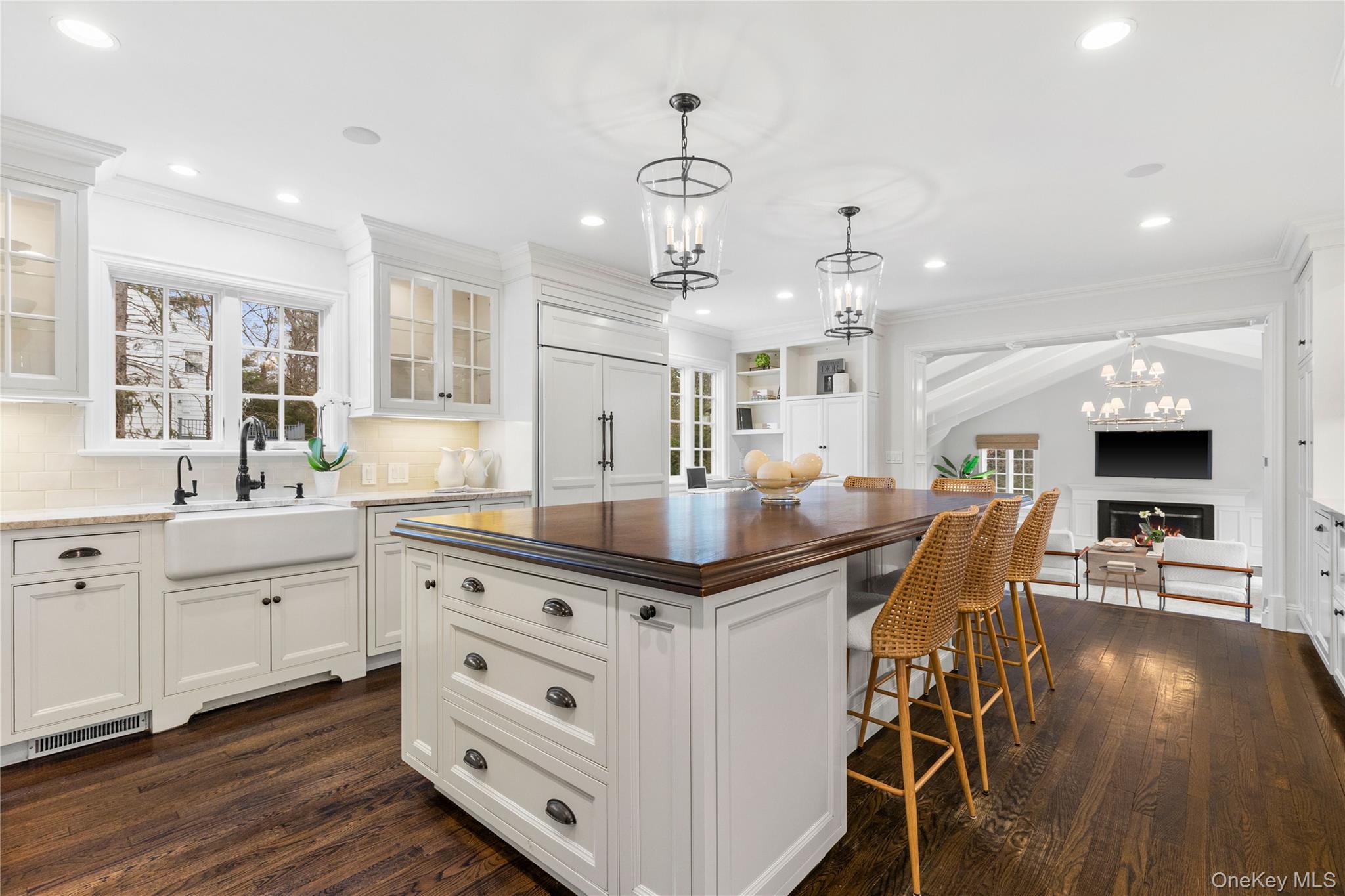 37 Bates Road Harrison, NY 10528 - Photo 41 of 41 a kitchen with stainless steel appliances granite countertop a stove a sink a dining table and chairs with wooden floor