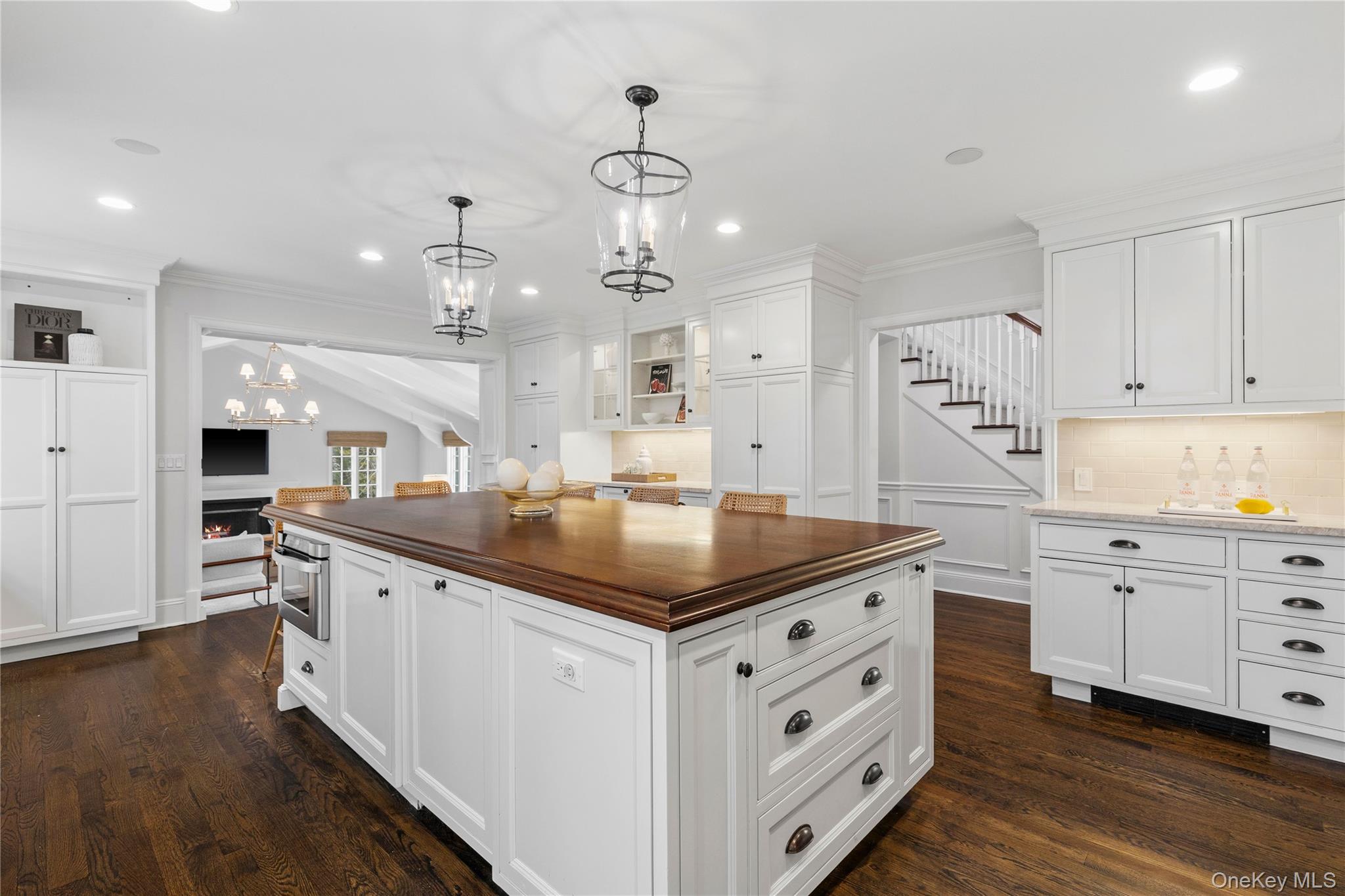 37 Bates Road Harrison, NY 10528 - Photo 11 of 41 a kitchen with kitchen island granite countertop a sink counter space and stainless steel appliances