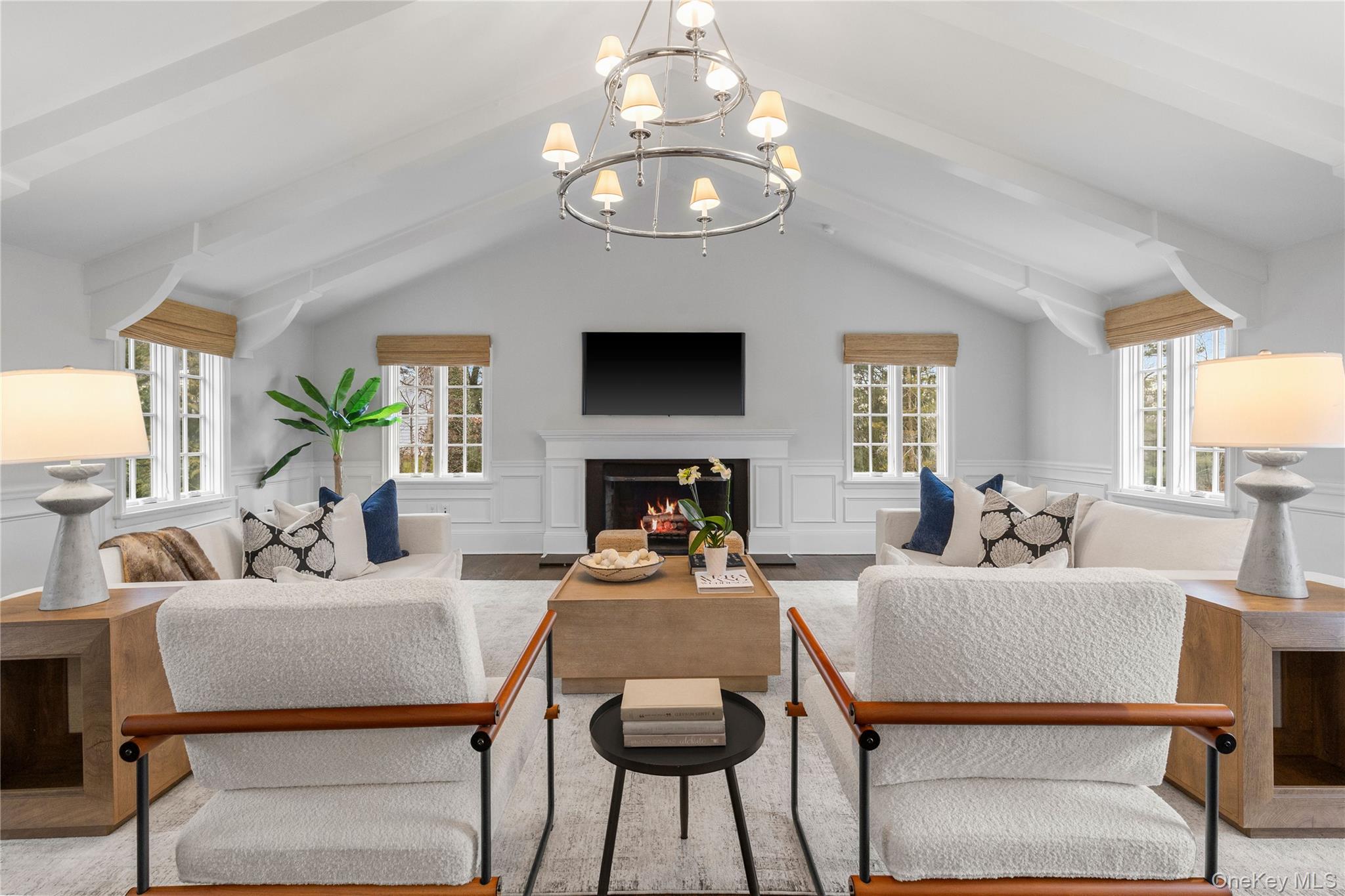 37 Bates Road Harrison, NY 10528 - Photo 13 of 41 a living room with fireplace furniture and a flat screen tv