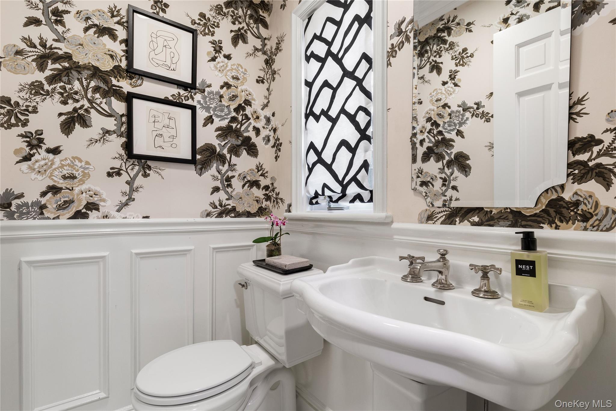 37 Bates Road Harrison, NY 10528 - Photo 16 of 41 a bathroom with a sink and a mirror