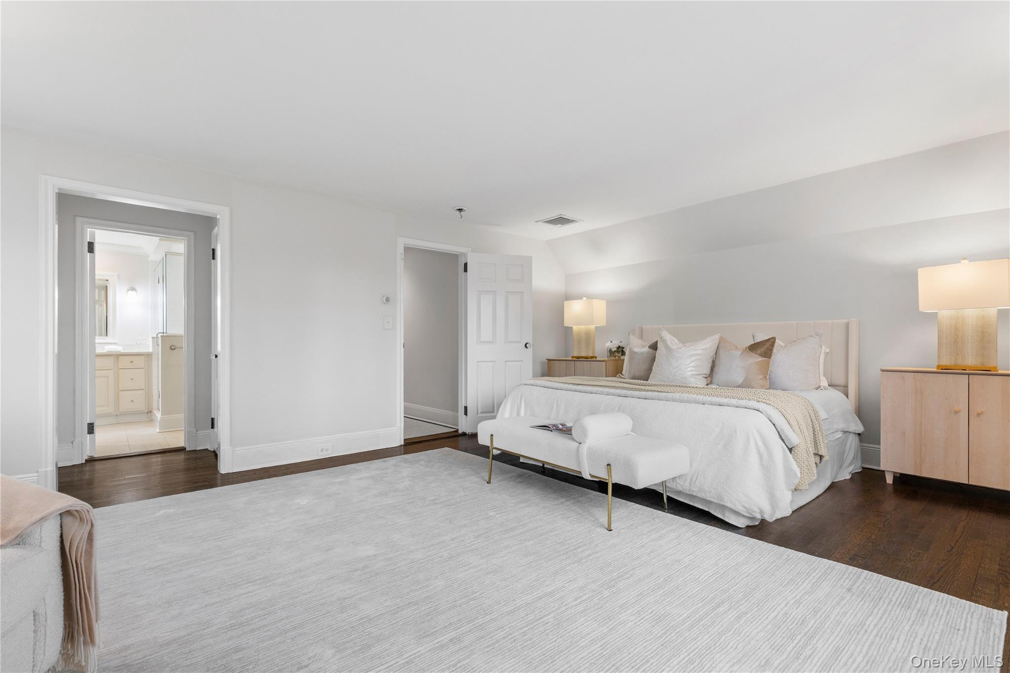 37 Bates Road Harrison, NY 10528 - Photo 18 of 41 a spacious bedroom with a bed and a large window