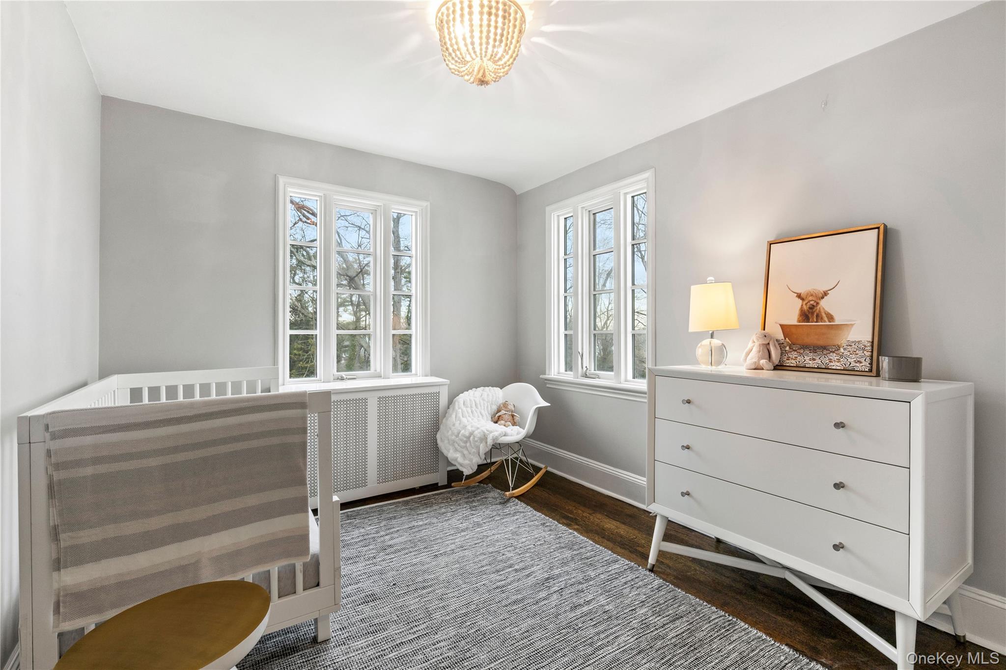 37 Bates Road Harrison, NY 10528 - Photo 25 of 41 a room with a baby bed baby crib and a window