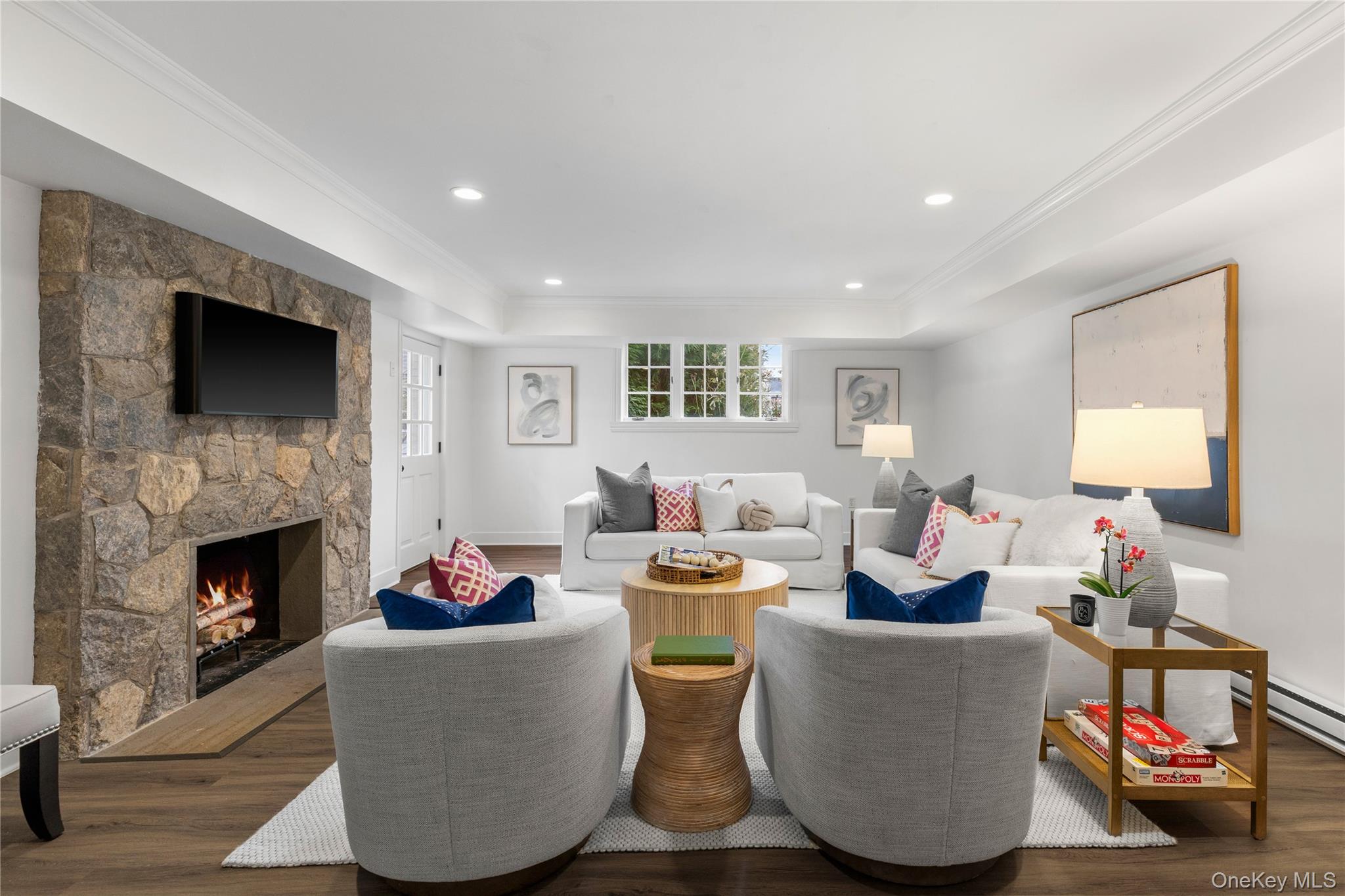 37 Bates Road Harrison, NY 10528 - Photo 26 of 41 a living room with fireplace furniture and a flat screen tv