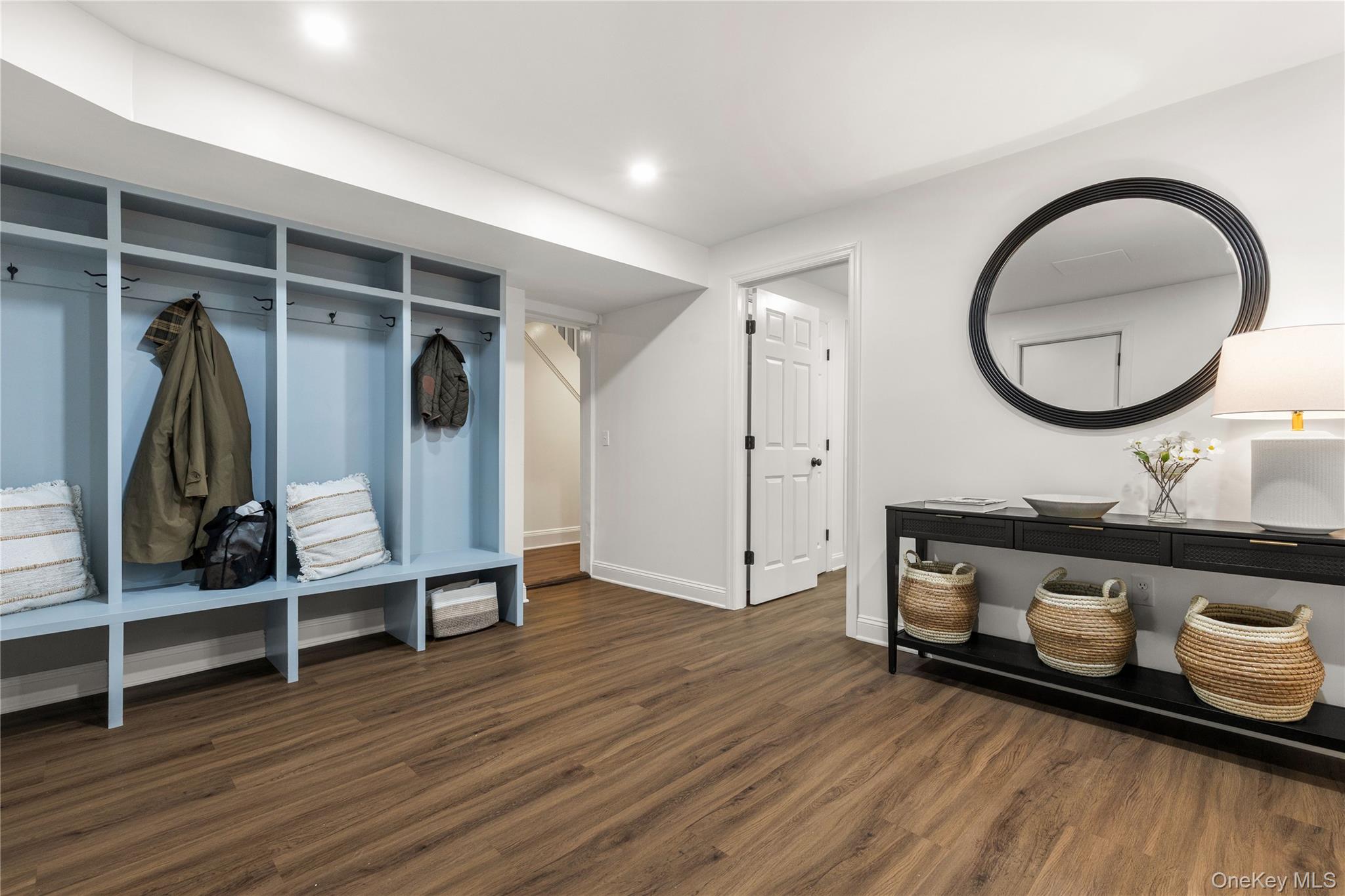 37 Bates Road Harrison, NY 10528 - Photo 28 of 41 a living room with wooden floor and white walls