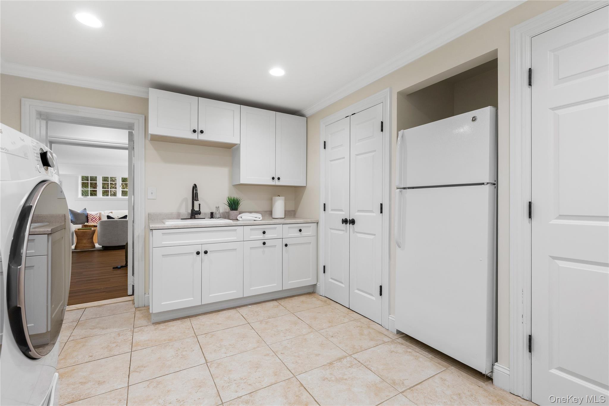 37 Bates Road Harrison, NY 10528 - Photo 30 of 41 a kitchen with cabinets and white appliances