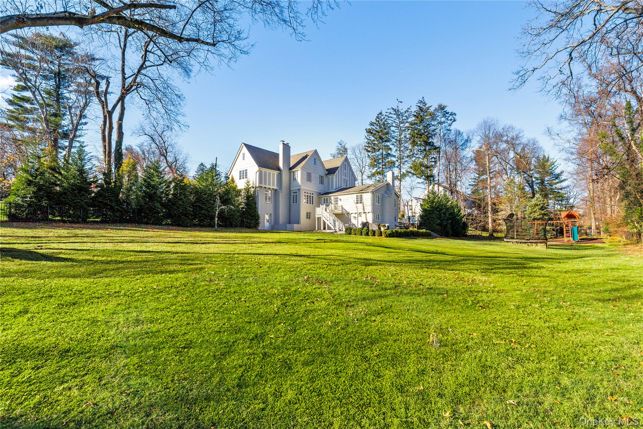 37 Bates Road Harrison, NY 10528 - Photo 32 of 41 a front view of a house with a yard