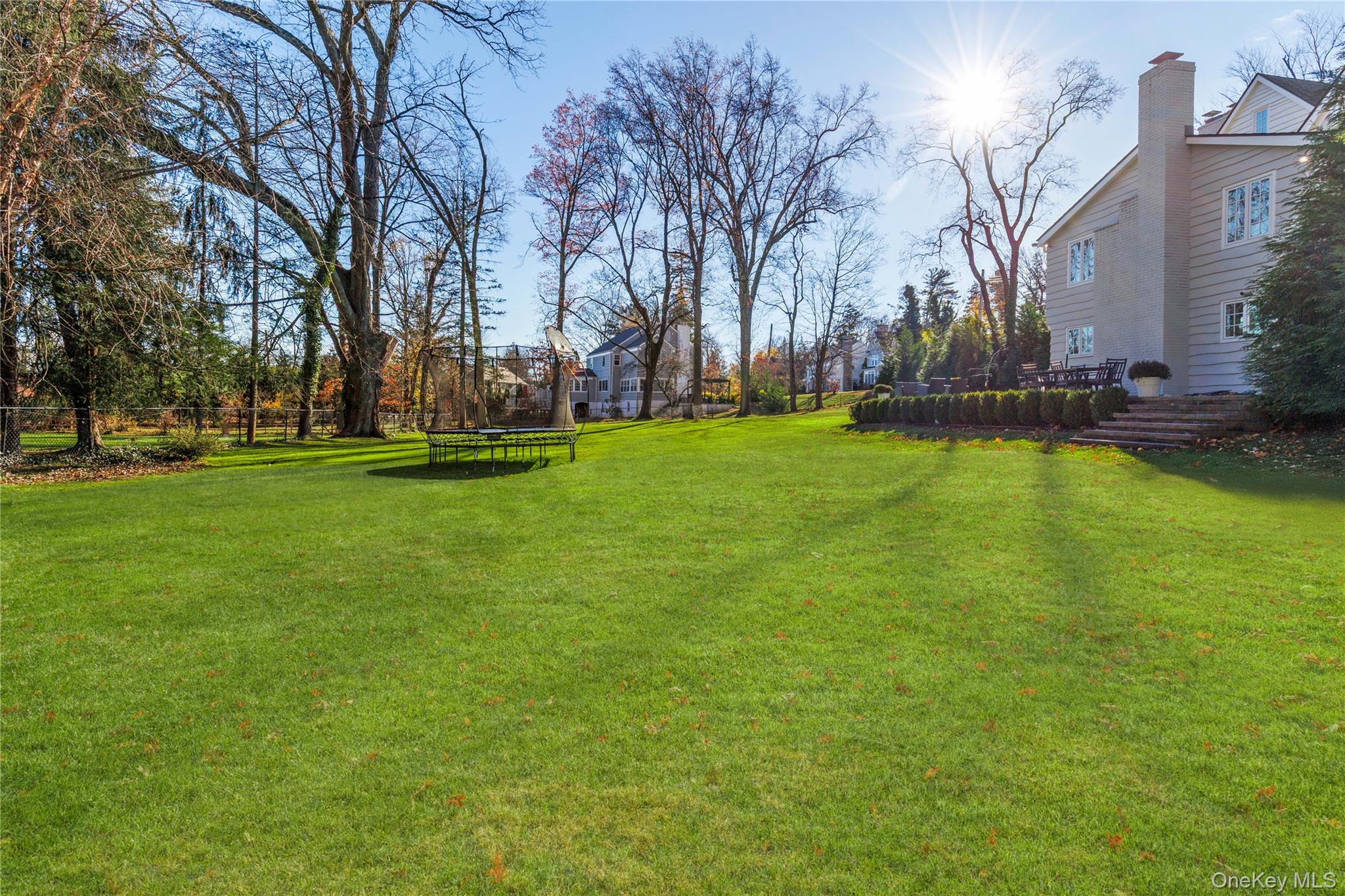 37 Bates Road Harrison, NY 10528 - Photo 35 of 41 a view of a swimming pool with an outdoor space and seating area