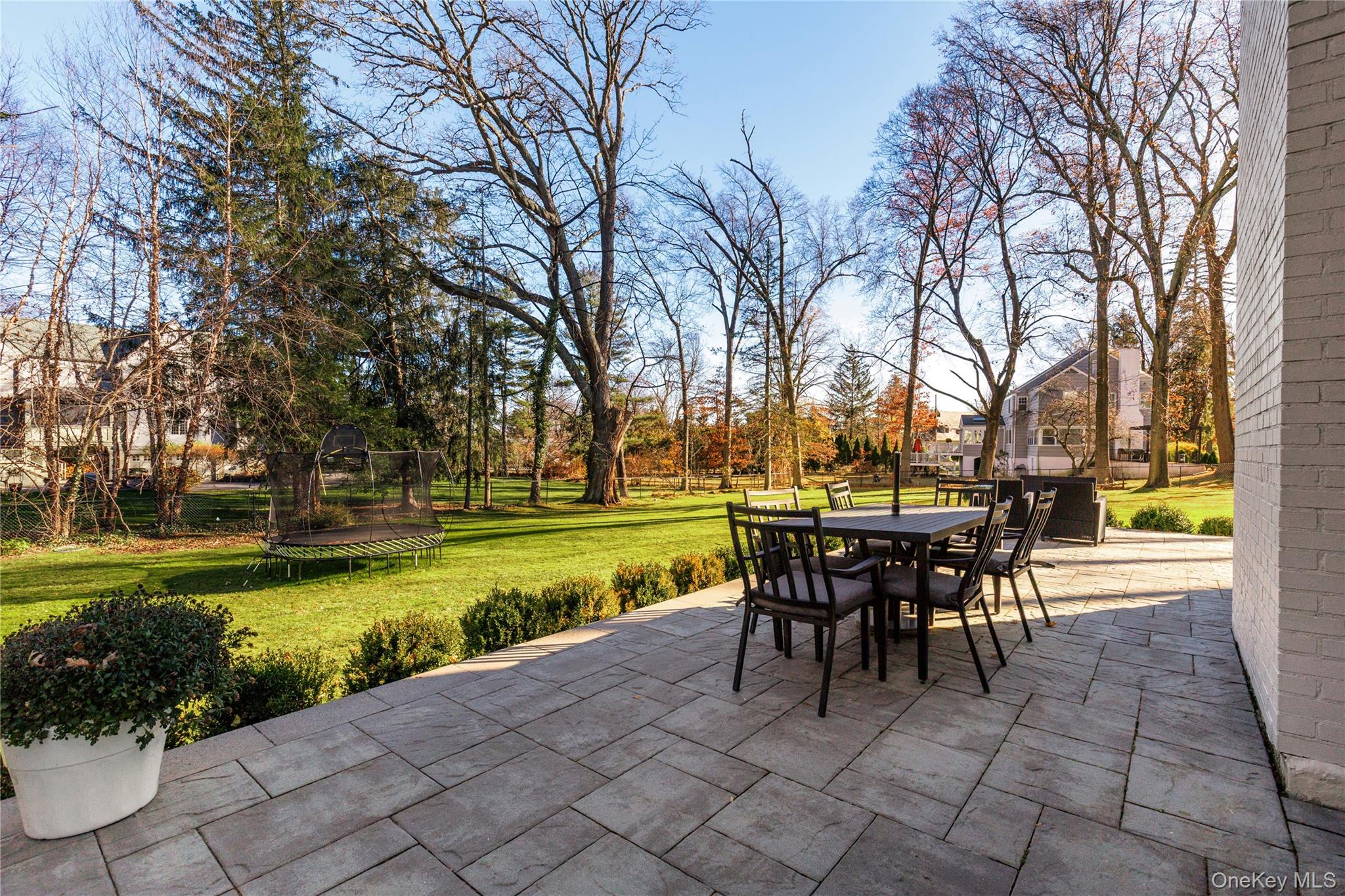 37 Bates Road Harrison, NY 10528 - Photo 36 of 41 a view of a swimming pool and outdoor seating