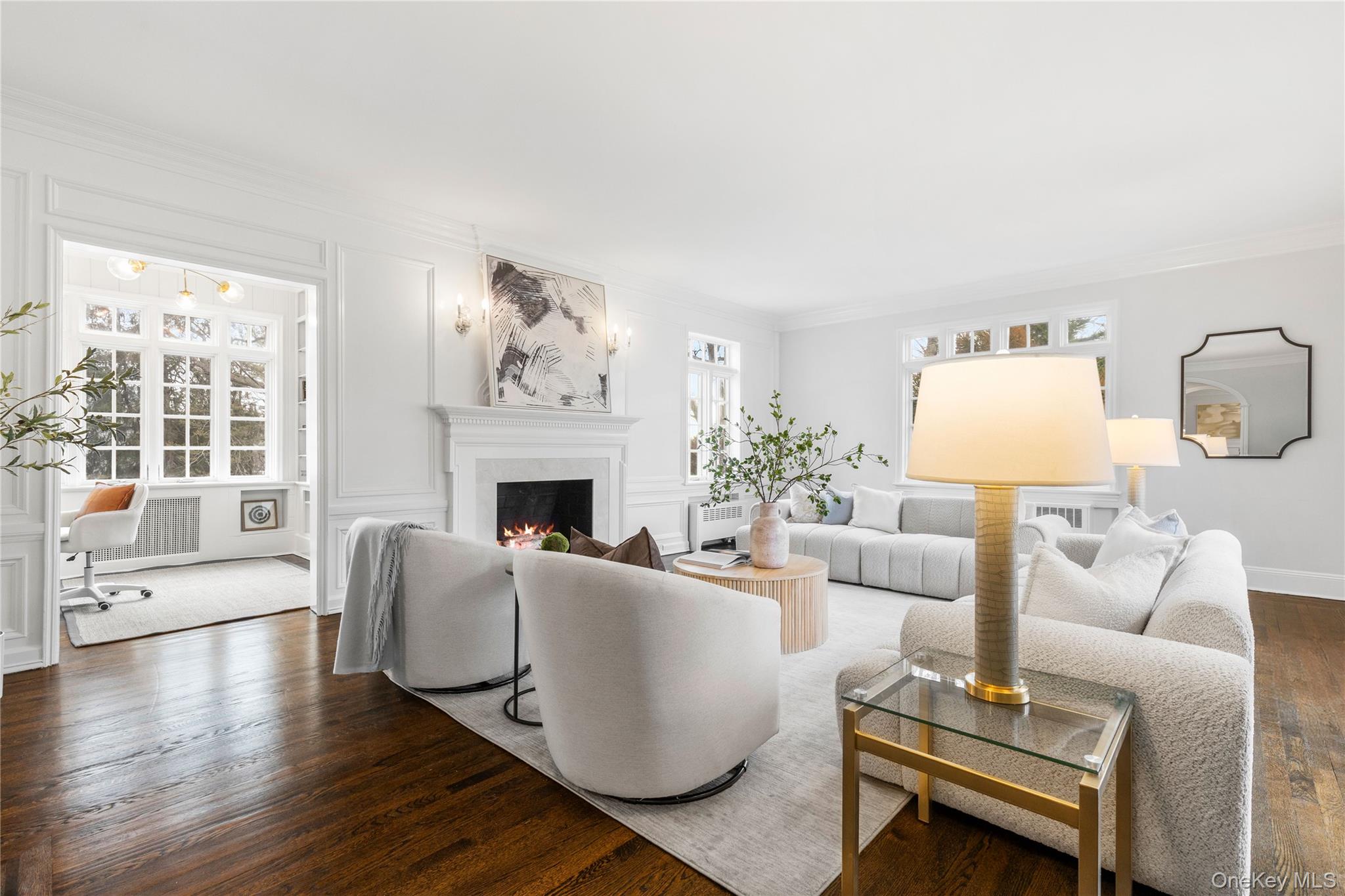 37 Bates Road Harrison, NY 10528 - Photo 6 of 41 a living room with furniture a large window and a fireplace