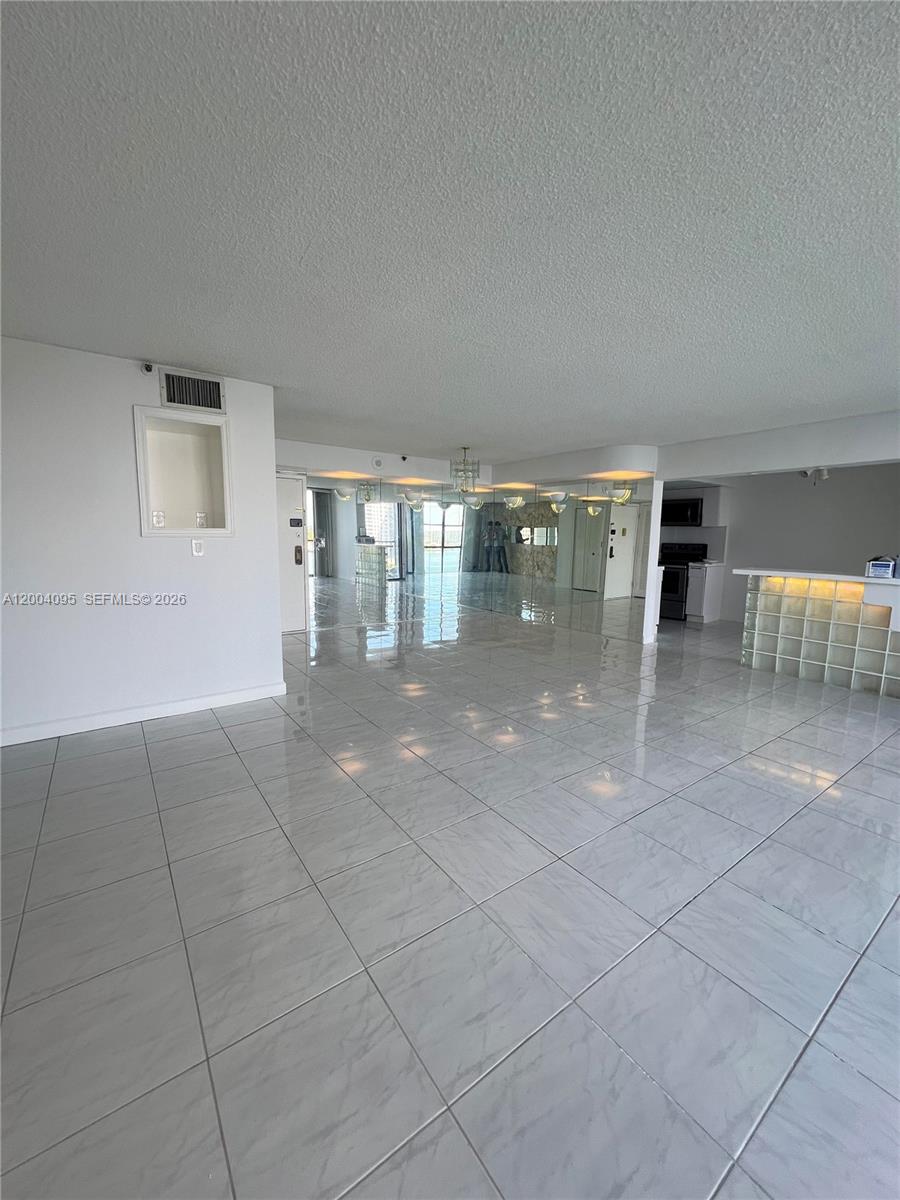 17500 North Bay Road, Unit S907 Sunny Isles Beach, FL 33160 - Photo 12 of 24 a view of livingroom with dining area