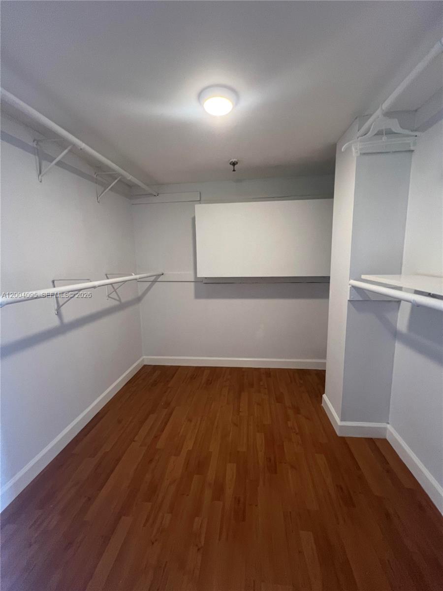 17500 North Bay Road, Unit S907 Sunny Isles Beach, FL 33160 - Photo 17 of 24 a view of a room with wooden floor