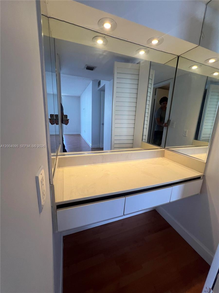 17500 North Bay Road, Unit S907 Sunny Isles Beach, FL 33160 - Photo 20 of 24 a bathroom with a sink and a mirror