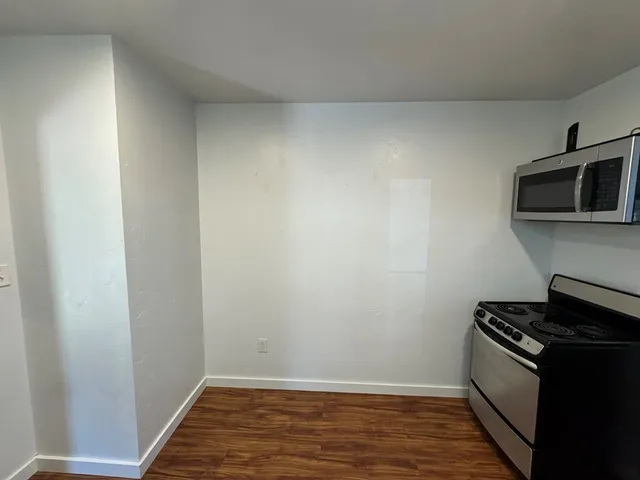 a view of a kitchen from the hallway