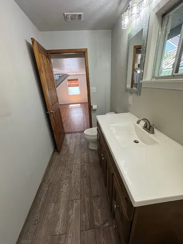 a bathroom with a sink and mirror