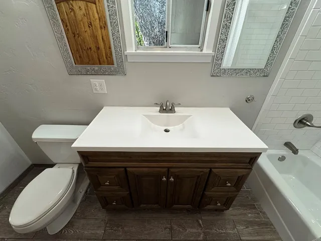 a bathroom with a sink and a toilet