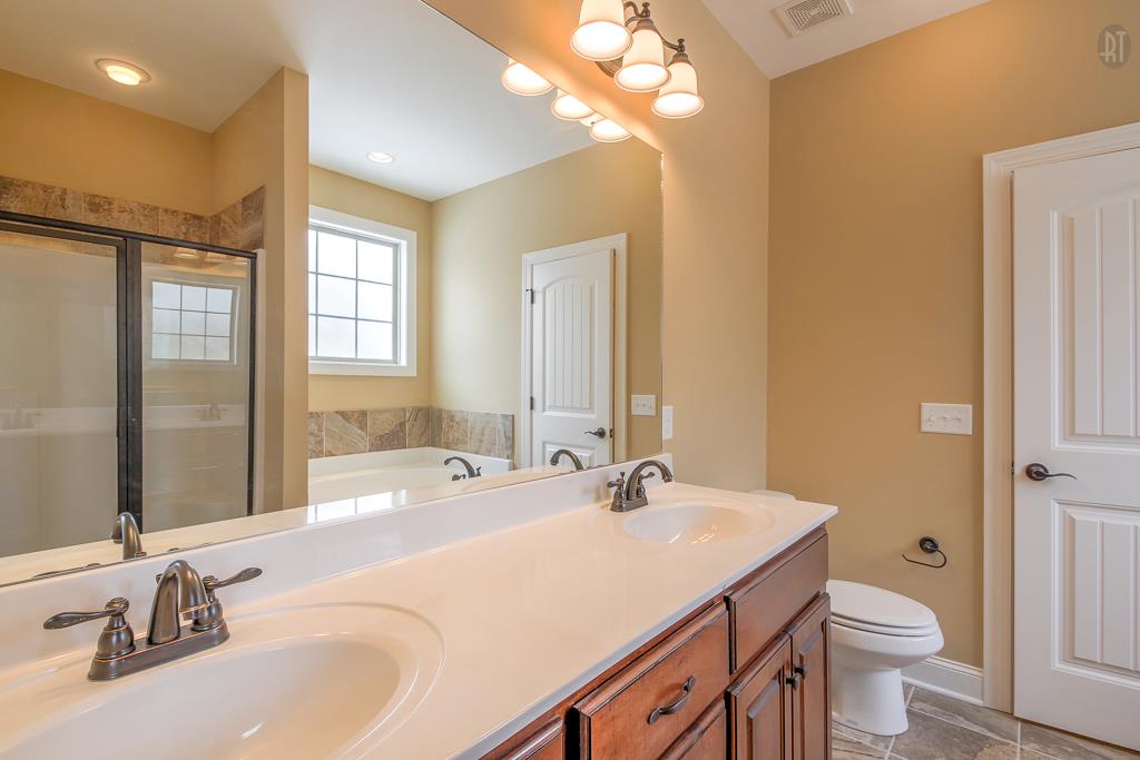 1208 Rimrock Road Smyrna, TN 37167 - Photo 14 of 20 a bathroom with a sink and a large mirror