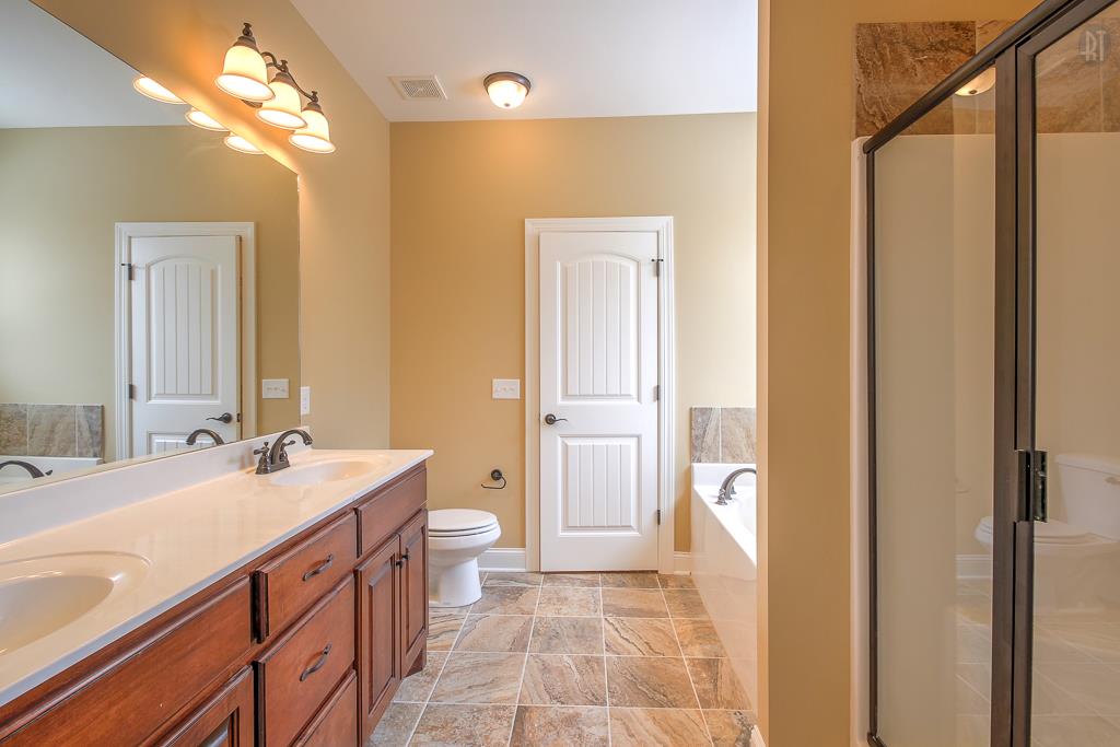 1208 Rimrock Road Smyrna, TN 37167 - Photo 15 of 20 a bathroom with a double vanity sink mirror and toilet