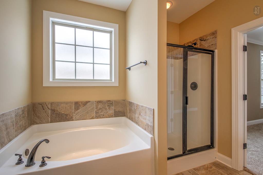 1208 Rimrock Road Smyrna, TN 37167 - Photo 16 of 20 a white bath tub sitting next to a shower